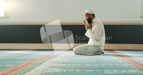 Image of Quran, islamic and man reading for faith in a mosque for praying, peace and spiritual care in holy religion for Allah. Respect, Ramadan and Muslim person with kindness, hope and humble after worship