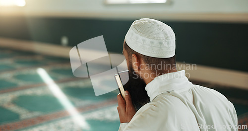 Image of Islamic man, kiss quran and mosque for faith, reading or mindfulness with worship, praise or back for study. Muslim person, religion and peace in book, prayer or thinking with meditation in Palestine