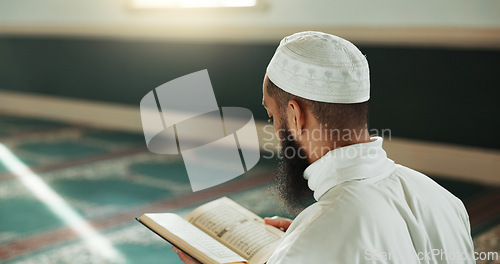 Image of Islamic man, kiss quran and mosque for faith, reading or mindfulness with worship, praise or back for study. Muslim person, religion and peace in book, prayer or thinking with meditation in Palestine