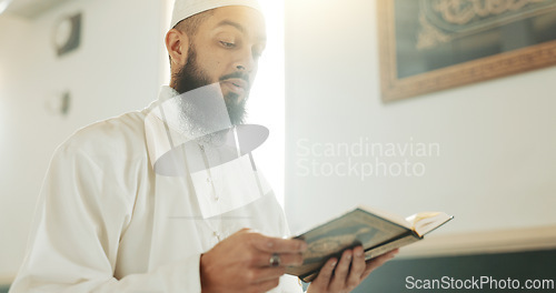 Image of Quran, Muslim and man reading for faith in a mosque for praying, peace and spiritual care in holy religion for Allah. Respect, Ramadan and Islamic person with kindness, hope and humble after worship