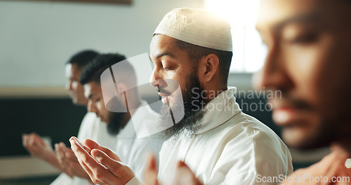 Image of Muslim, praying and group in a Mosque for spiritual religion together as men to worship Allah in Ramadan. Islamic, Arabic and holy people with peace or respect for gratitude, trust and hope for eid