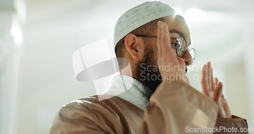 Image of Islamic prayer, faith and man in mosque with gratitude, mindfulness and love for God or Allah. Worship, religion and Muslim imam praying for hope in holy temple praise, spiritual teaching and peace.