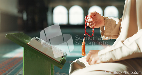 Image of Islam, prayer beads and man in mosque with Quran, mindfulness and gratitude in faith. Worship, religion and Muslim scholar in holy temple for praise with book, spiritual teaching and peace meditation