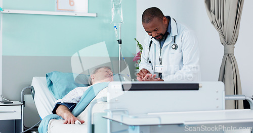 Image of Hospital checkup, sick and a black man with a patient for exam after surgery, treatment or a virus. Help, talking and an African medical employee with a person in a clinic bed for consulting