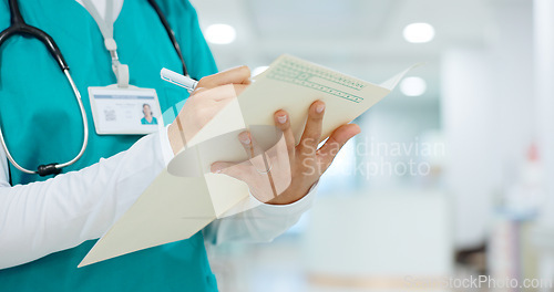 Image of Nurse, writing and hands on folder in hospital or document for insurance, healthcare and report with patient information. Paperwork, checklist or doctor with medical notes in file and chart in clinic