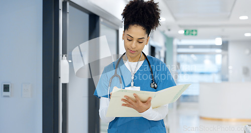 Image of Nurse, writing and document in hospital for insurance, healthcare and compliance report with patient information. Paperwork, checklist and doctor with medical notes in file, chart or folder in clinic