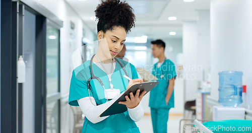 Image of Doctor, holding and writing on clipboard in hospital for patient, care or treatment after exam in emergency room. Woman, nurse and medicine after consulting for health, wellness or surgery in space