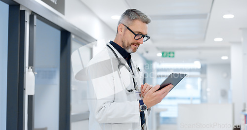 Image of News, tablet or mature doctor in hospital with research on website to search for medicine info online. Man reading, senior or medical healthcare nurse browsing on technology for telehealth in clinic