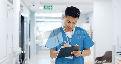 Image of Doctor, planning and writing in documents, medical checklist or charts for hospital notes or clinic service. Healthcare worker, asian man or nurse smile for clipboard, paperwork or thinking in clinic