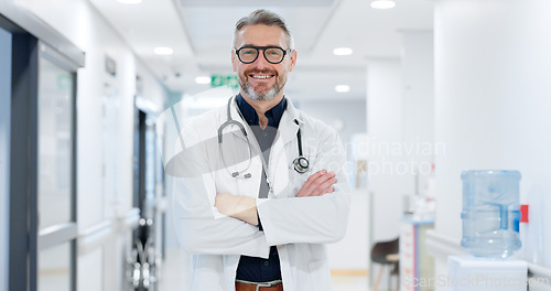 Image of Professional, face and man or doctor with arms crossed for wellness, trust and service in hospital or clinic. Portrait, person and expert with happiness for career, cardiology or glasses at workplace