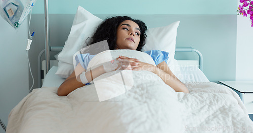 Image of Hospital bed, woman and stress from medical, surgery and ICU patient in a clinic from help. Anxiety, thinking and tired female person with healthcare, sick and recovery with mental health and care