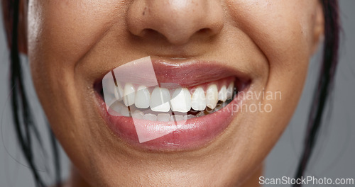 Image of Woman, mouth and closeup in studio for dental wellness, beauty and change with cosmetics by background. Girl, teeth whitening and smile for cleaning, health and zoom for oral care with hygiene