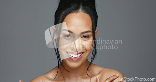 Image of Face, skincare and happy woman in studio for beauty isolated on a gray background. Portrait, natural and model touch skin in spa facial treatment for aesthetic, glow and cosmetic wellness for health