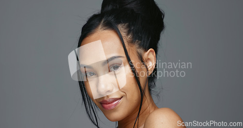 Image of Face, skincare and beauty of woman in studio isolated on a gray background mockup space. Portrait, natural and serious model in spa facial treatment for aesthetic, cosmetic and wellness for health