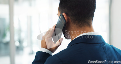 Image of Startup, deal or back of businessman on a phone call talking, networking or speaking of ideas in office. Listening, mobile communication or male entrepreneur in conversation for a negotiation offer