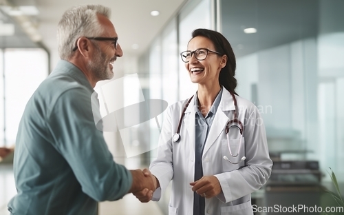 Image of In a modern hospital corridor, doctors exchange handshakes, reflecting professional unity and collaborative teamwork