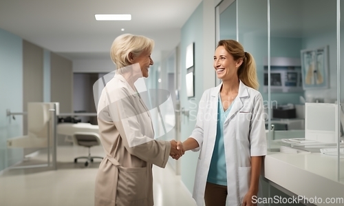 Image of A compassionate doctor shares a handshake with her patient, signifying a successful and trustful completion of hospital treatment