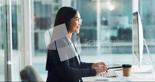 Image of Business woman, typing on computer and happy copywriting, online planning and office software. Young worker, editor or writer working on desktop for research, report or editing of company newsletter
