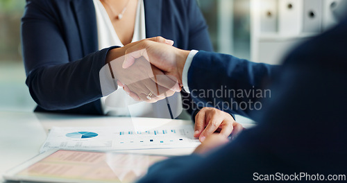 Image of Business people, closeup and handshake for deal, agreement and partnership negotiation in office. Shaking hands, contract and hiring offer for recruitment, interview and financial analyst in meeting