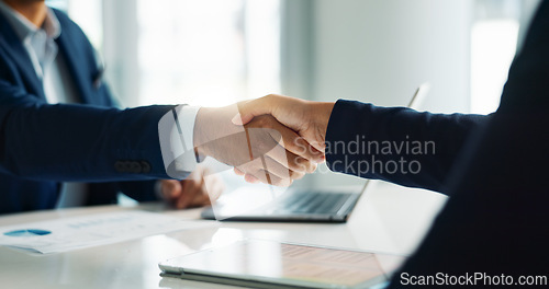 Image of Business people, closeup and handshake for deal, agreement and partnership negotiation in office. Shaking hands, contract and hiring offer for recruitment, interview and financial analyst in meeting