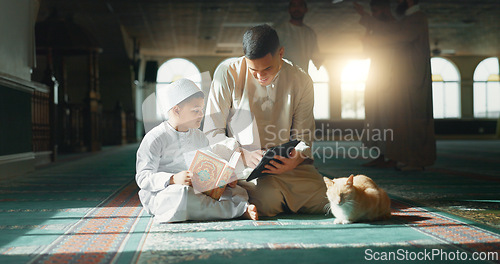 Image of Quran, child and man teaching in a mosque for praying, peace and spiritual care in holy religion for Allah. Reading book, learning or Muslim person with tablet, kid or education to help worship God