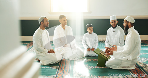 Image of Muslim, religion and people in mosque for praying, religious education and worship or prayer. Islamic community, knowledge and men talking on carpet for Ramadan Kareem, learning Quran and Eid Mubarak