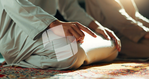 Image of Islam, prayer and men in mosque on knees, mindfulness and gratitude in faith, love and commitment. Worship, religion and Muslim people together in holy temple praise, spiritual teaching and peace.