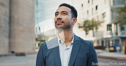 Image of Asian businessman, city and positive by buildings in morning, office view and travel to workplace in accounting career. Young person, smile and professional with ambition and working in town in cbd