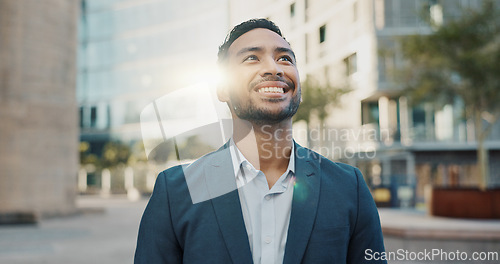 Image of Asian businessman, city and positive by buildings in morning, office view and travel to workplace in accounting career. Young person, smile and professional with ambition and working in town in cbd