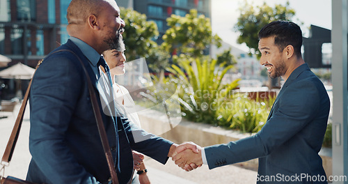 Image of Business people, welcome and handshake in city meeting for partnership, intro or collaboration outdoor. Hello, shaking hands and team outside with thank you, support or onboarding negotiation success