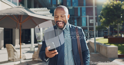 Image of Business man, phone and celebration in city for profit, success or investment revenue on fintech. African professional person, smartphone and winner for cheers, smile or bonus in stock market trading