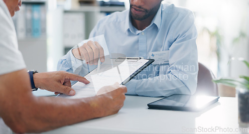 Image of Man, doctor and hands with form in consultation for signature, application or health insurance at hospital. Closeup of person or medical employee explaining document or paperwork to patient at clinic