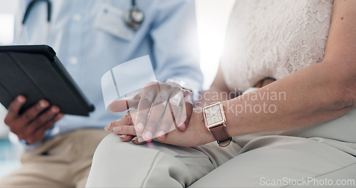 Image of Holding hands, doctor and patient on tablet with comfort for results, cancer and empathy for kindness. People, medic or digital touchscreen with consultation, counselling or solidarity in hospital