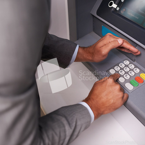 Image of Businessman, hands and typing pin on ATM for banking, privacy or security at money machine. Closeup of man entering digit or secret code for cash withdrawal, deposit or finance at electronic system