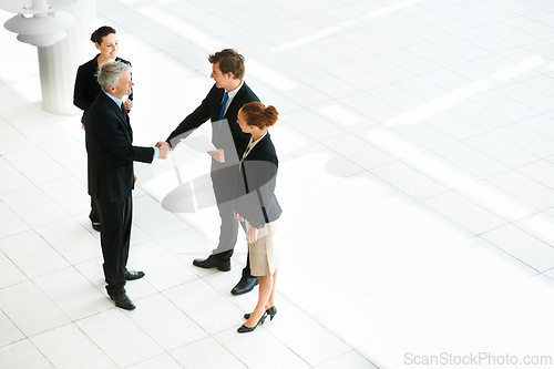 Image of Business people, shaking hands and thank you for welcome in introduction, hello and opportunity. Partnership, onboarding and coworkers in agreement, top view and promotion in office or collaboration