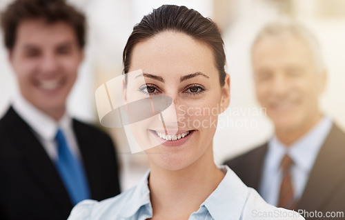 Image of Business woman, happy in portrait and leadership at law firm, pride and ambition with attorney team. Corporate lawyer, smile for career in justice and supervisor in professional headshot at office