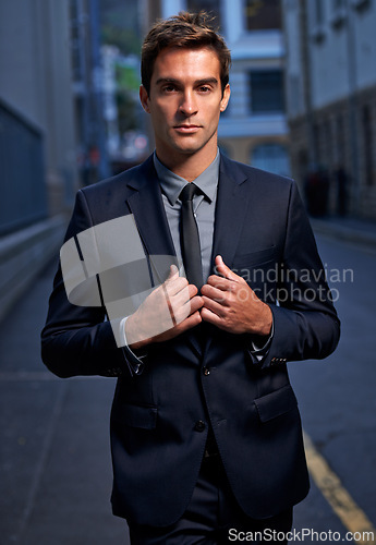 Image of City, night and portrait of business man in style for commute, walking and travel from office. Professional fashion, corporate worker and person in urban town for entrepreneurship, job and career