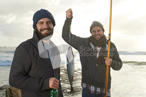 Image of Happy, people and fishing portrait at sea with pride for tuna catch at sunset. Fisherman, friends and smile holding fish and rod in hand on holiday, adventure or travel in nature on vacation at ocean