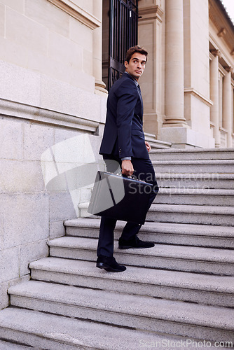 Image of Business, briefcase and man walking on stairs outside law firm in city with evening commute, sidewalk and court building. Businessman, lawyer or attorney on outdoor steps with bag for urban travel.