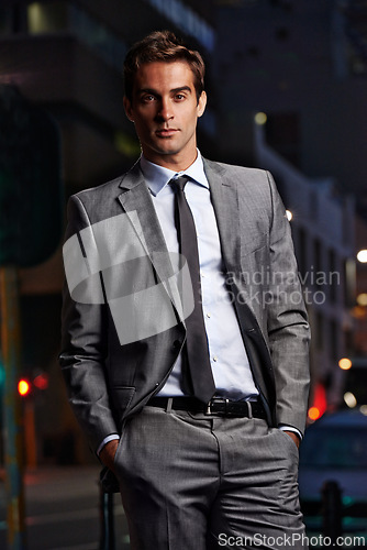 Image of Fashion, night and portrait of businessman in city for commute, travel from office and style. Professional, corporate worker and person in urban town for entrepreneurship, job and career in London