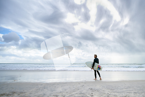 Image of Surfboard, ocean and man on beach for surfing on vacation, holiday and weekend for wellness. Travel mockup, fitness and person for water sports, hobby and exercise for adventure and training in sea