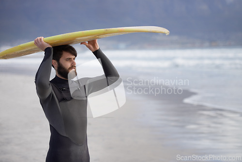 Image of Surfboard, thinking and man on beach for surfing on vacation, holiday and weekend in ocean. Nature, waves and person in wetsuit for water sports, hobby and exercise for adventure and freedom in sea