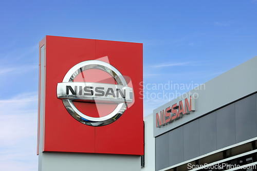 Image of Nissan Car Manufacturer Logo Outside Dealership
