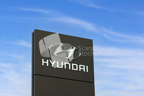 Image of Hyundai Automotive Manufacturer Logo Against Sky