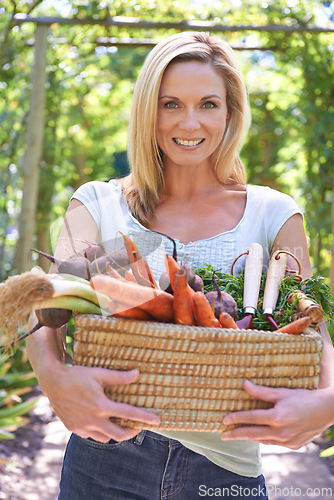 Image of Woman, portrait and basket of vegetables for agriculture harvest for small business, production or sustainability. Female person, face and carrots or beetroot or eco farming career, organic or diet