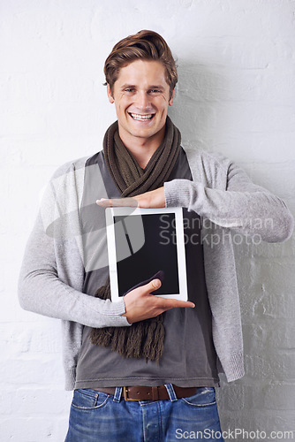 Image of Happy man, portrait and tablet screen for advertising or marketing on a white studio background. Face of young male person with smile and technology display in casual fashion for app or mockup space