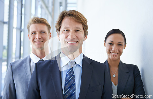 Image of Teamwork, office and portrait of happy business people for pride, confidence and collaboration in hallway. Corporate lawyers, professional and men and woman for partnership, leadership and about us