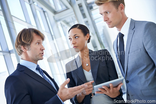 Image of Discussion, teamwork and business people in office with tablet for legal company, law firm and collaboration. Corporate, attorney and lawyers on digital tech for research, website and networking