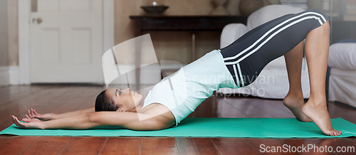 Image of Yoga, stretching and woman on floor for balance in home for training, exercise and healthy body. Pilates, house workout and person in yogi pose for wellness, fitness and warm up in living room