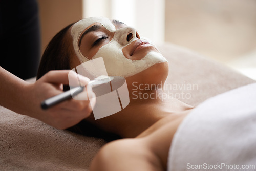 Image of Beauty, relax and woman with face mask at spa for glow, wellness and skincare routine with self care. Cosmetic, pamper and female person with natural clay facial dermatology treatment at salon.